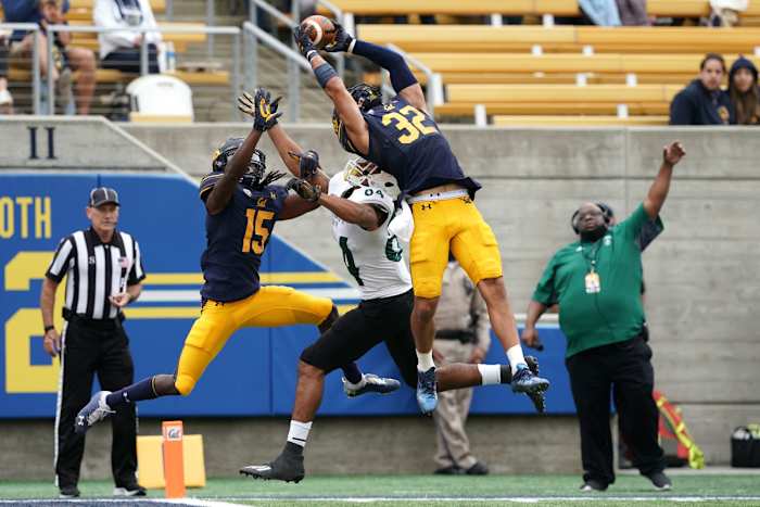 California Golden Bears safety Daniel Scott (32) intercepts a pass intended for Sacramento State Hornets wide receiver Pierre Williams (84).